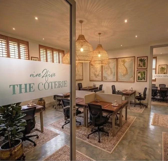 The Coterie wordmark on the glass partition